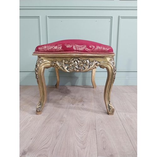 204 - French gilt wood and upholstered foot stool on cabriole legs. {54 cm H x 95 cm W x 66 cm D}.