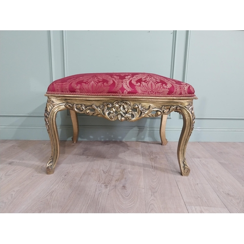 204 - French gilt wood and upholstered foot stool on cabriole legs. {54 cm H x 95 cm W x 66 cm D}.