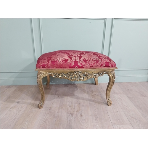 204 - French gilt wood and upholstered foot stool on cabriole legs. {54 cm H x 95 cm W x 66 cm D}.