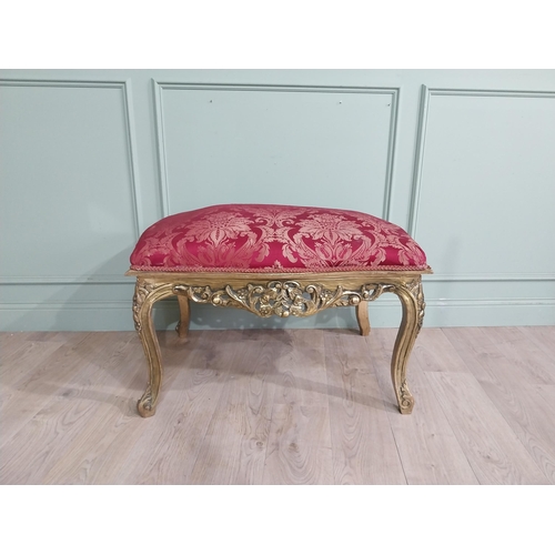 204 - French gilt wood and upholstered foot stool on cabriole legs. {54 cm H x 95 cm W x 66 cm D}.