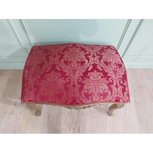 204 - French gilt wood and upholstered foot stool on cabriole legs. {54 cm H x 95 cm W x 66 cm D}.