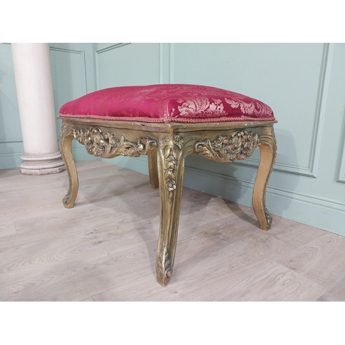 204 - French gilt wood and upholstered foot stool on cabriole legs. {54 cm H x 95 cm W x 66 cm D}.