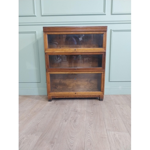 21 - Edwardian Globe Wernicke Ltd three piece oak glazed stackable bookcase. {105 cm H x 85 cm W x 28 cm ... 