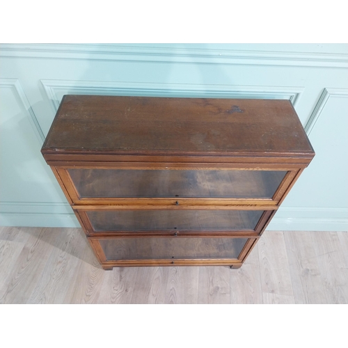 21 - Edwardian Globe Wernicke Ltd three piece oak glazed stackable bookcase. {105 cm H x 85 cm W x 28 cm ... 