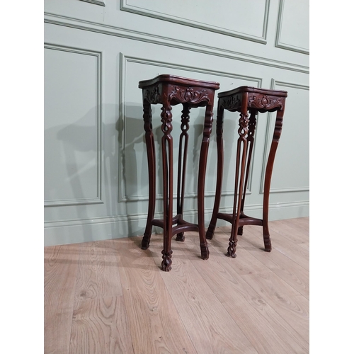 213 - Pair of carved hardwood oriental jardiniere stands with marble tops. {93 cm H x 30 cm W x 30 cm D}.