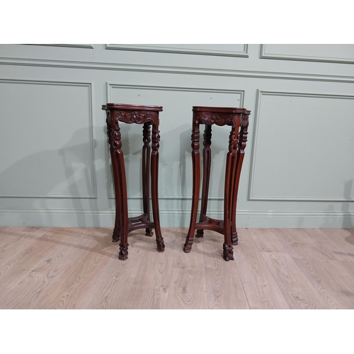 213 - Pair of carved hardwood oriental jardiniere stands with marble tops. {93 cm H x 30 cm W x 30 cm D}.