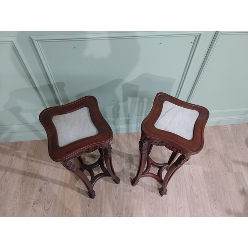 213 - Pair of carved hardwood oriental jardiniere stands with marble tops. {93 cm H x 30 cm W x 30 cm D}.