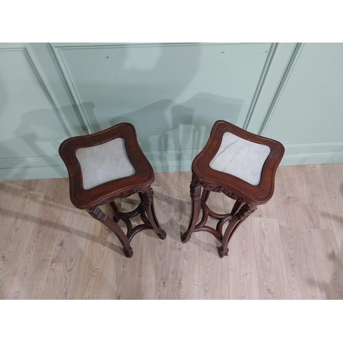 213 - Pair of carved hardwood oriental jardiniere stands with marble tops. {93 cm H x 30 cm W x 30 cm D}.