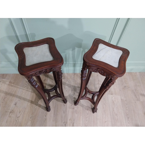 213 - Pair of carved hardwood oriental jardiniere stands with marble tops. {93 cm H x 30 cm W x 30 cm D}.