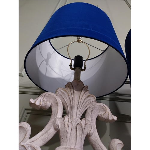 22 - Pair of vintage style painted table lamps with blue cloth shades. {68 cm H x 33 cm Dia.}.