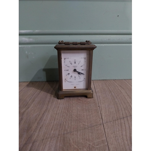 229 - Edwardian brass carriage clock by Bayard Paris. {12 cm H x 8 cm W x 6 cm D}.