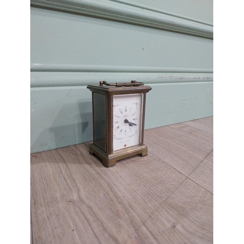 229 - Edwardian brass carriage clock by Bayard Paris. {12 cm H x 8 cm W x 6 cm D}.