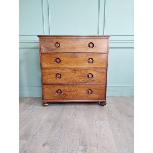 23 - 19th C. Camphorwood campaign chest with four long drawers on turned bun feet. {122 cm H x 116 cm W x... 