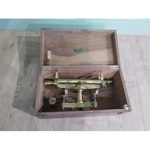 24 - Early 20th C. Brass theodolite in camphor wood case. {15 cm H x 40 cm W x 21 cm D].