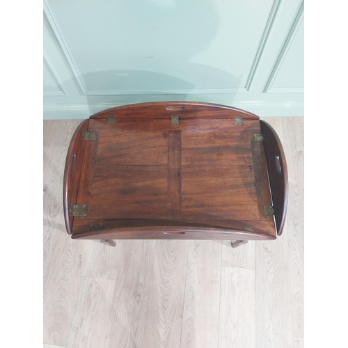 244 - 19th C. Mahogany oval campaign coffee table with double stretcher raised on tapered legs. {68 cm H x... 