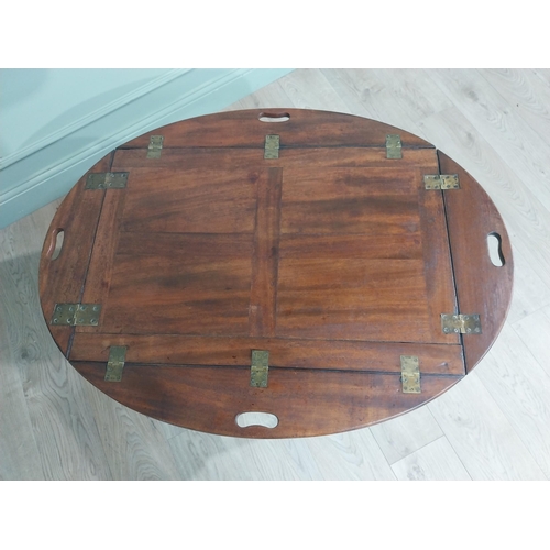 244 - 19th C. Mahogany oval campaign coffee table with double stretcher raised on tapered legs. {68 cm H x... 