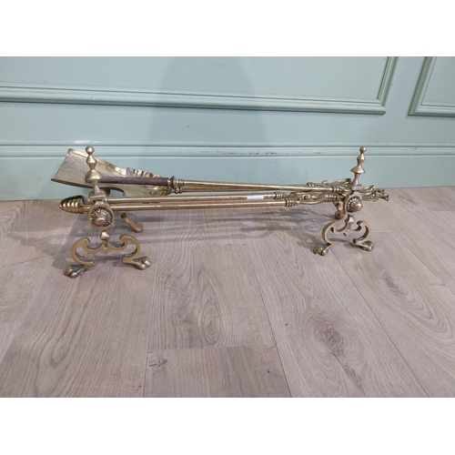 245 - Edwardian brass fire irons and dogs. {23 cm H x 73 cm W x 17 cm D}