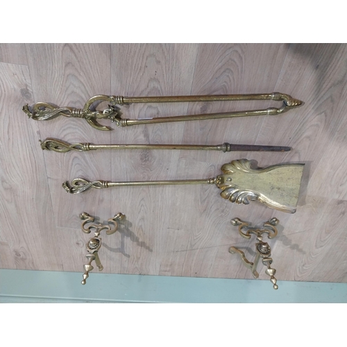 245 - Edwardian brass fire irons and dogs. {23 cm H x 73 cm W x 17 cm D}