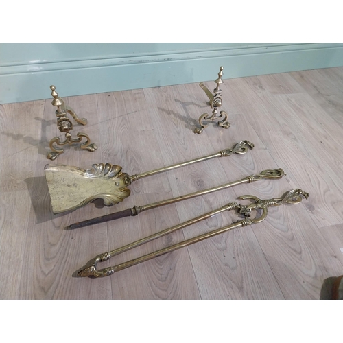 245 - Edwardian brass fire irons and dogs. {23 cm H x 73 cm W x 17 cm D}