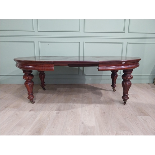 254 - Victorian mahogany D end dining table on four turned legs and brass castors. {73 cm H x 210 cm W x 1... 