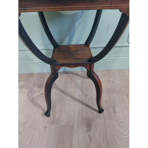 259 - 19th C. Rosewood lamp table with shaped inlaid top raised on u-shaped supports on splayed shaped fee... 