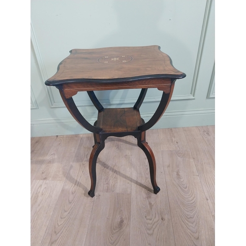 259 - 19th C. Rosewood lamp table with shaped inlaid top raised on u-shaped supports on splayed shaped fee... 