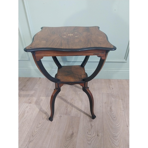 259 - 19th C. Rosewood lamp table with shaped inlaid top raised on u-shaped supports on splayed shaped fee... 