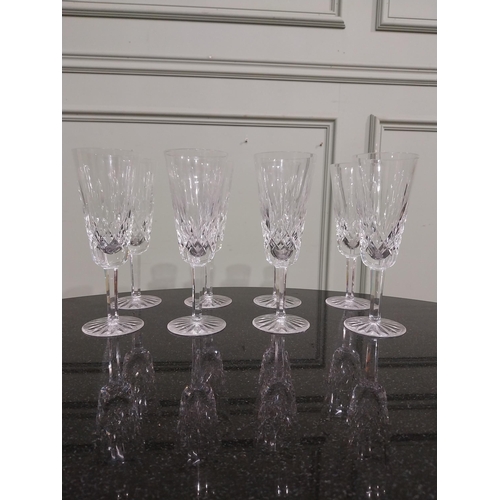 263 - Eight Waterford glass cut crystal champagne flutes. {18 cm H }.