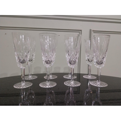 263 - Eight Waterford glass cut crystal champagne flutes. {18 cm H }.