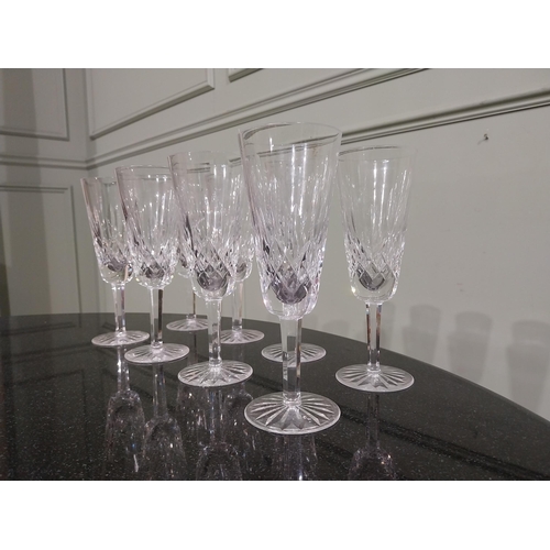 263 - Eight Waterford glass cut crystal champagne flutes. {18 cm H }.