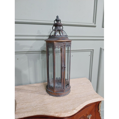 265 - Copperised metal and glass lantern. {64 cm H x 20 cm Dia.}.