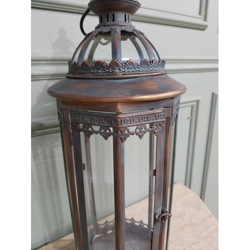 265 - Copperised metal and glass lantern. {64 cm H x 20 cm Dia.}.