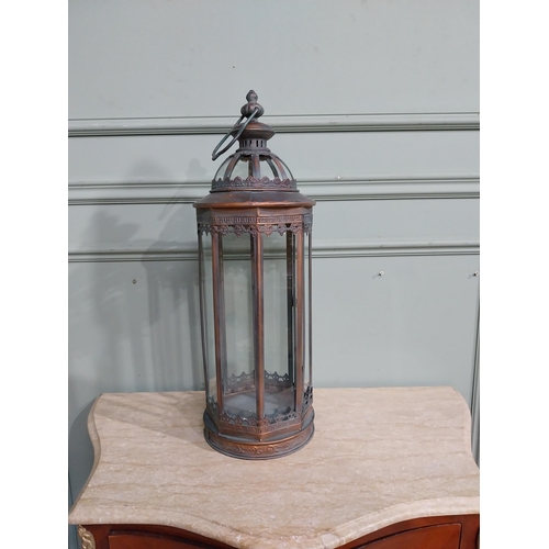 265 - Copperised metal and glass lantern. {64 cm H x 20 cm Dia.}.