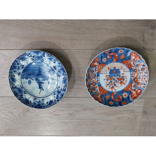 277 - Blue and white hand painted Dutch ceramic plate and decorative Oriental Imari plate. {22 cm Dia}.