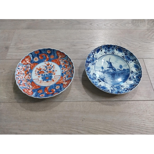 277 - Blue and white hand painted Dutch ceramic plate and decorative Oriental Imari plate. {22 cm Dia}.