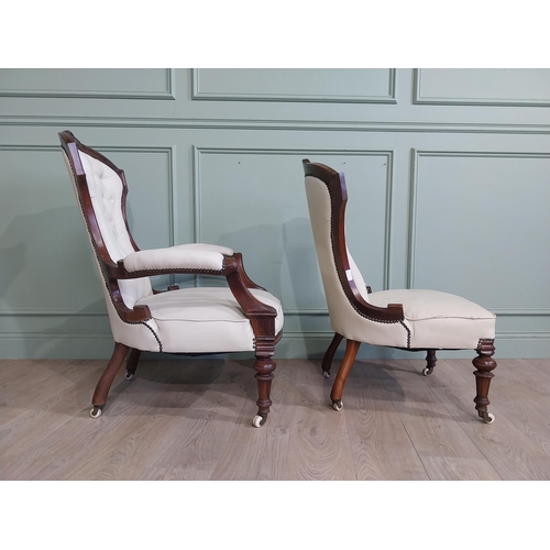 283 - Victorian carved mahogany and leather upholstered His and Her chairs on turned legs and castors. {10... 