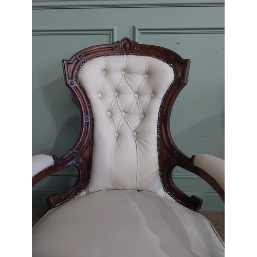 283 - Victorian carved mahogany and leather upholstered His and Her chairs on turned legs and castors. {10... 