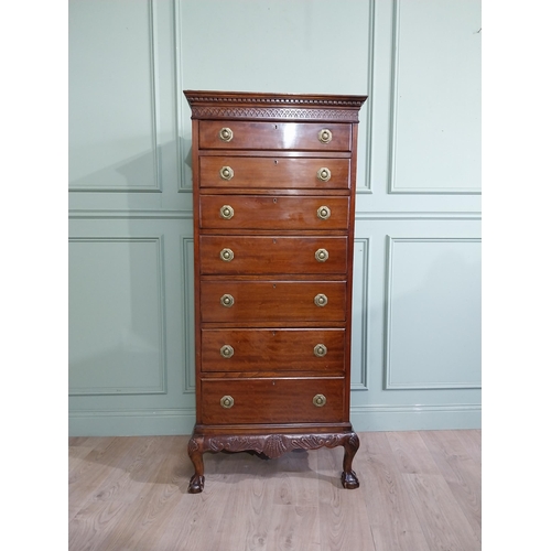 285 - Edwardian mahogany tallboy with seven graduated drawers above carved apron on claw and ball feet. {1... 