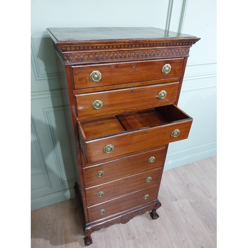 285 - Edwardian mahogany tallboy with seven graduated drawers above carved apron on claw and ball feet. {1... 