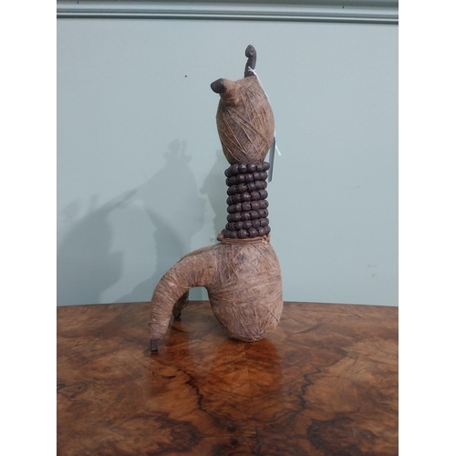 287 - Unusual wrought iron and  twine African sculpture. {28 cm H x 11 cm W x 12 cm D].