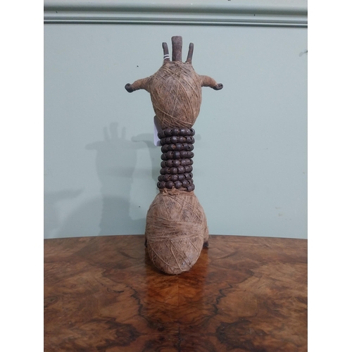 287 - Unusual wrought iron and  twine African sculpture. {28 cm H x 11 cm W x 12 cm D].