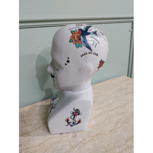 288 - Ceramic phrenology head. {28 cm H x 14 cm W x 13 cm D}.