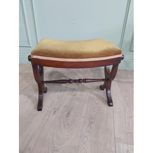 290 - Mahogany and upholstered stool in the Victorian style on x-frame supports with single turned stretch... 