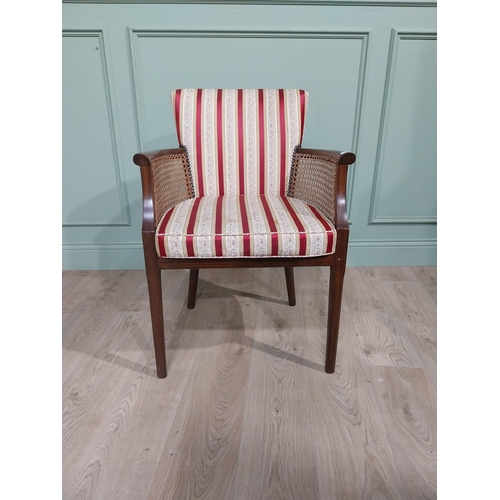 296 - 1950�s mahogany and upholstered armchair on square tapered legs. {85 cm H x 60 cm W x 50 cm D}.