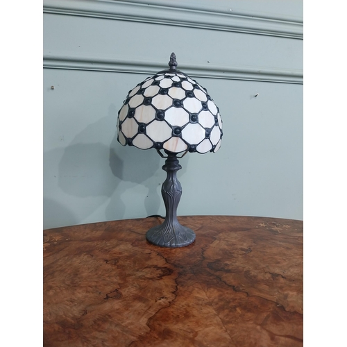 300 - Bronzed resin table lamp with Tiffany style shade. {36 cm H  x 20 cm Dia.}.