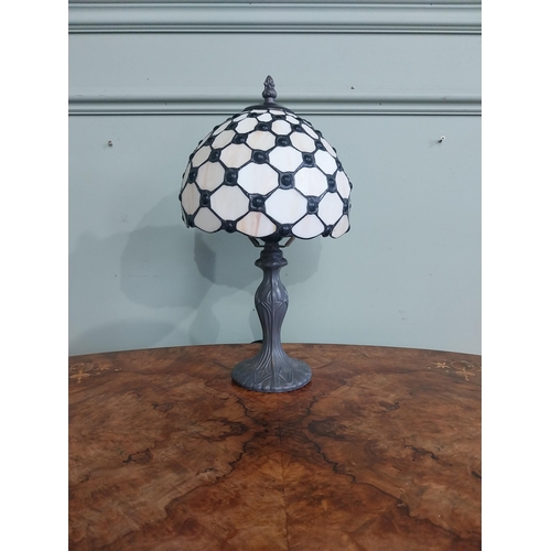 300 - Bronzed resin table lamp with Tiffany style shade. {36 cm H  x 20 cm Dia.}.