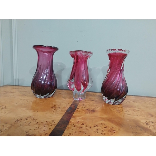 302 - Three ruby glass vases. {24 cm H}