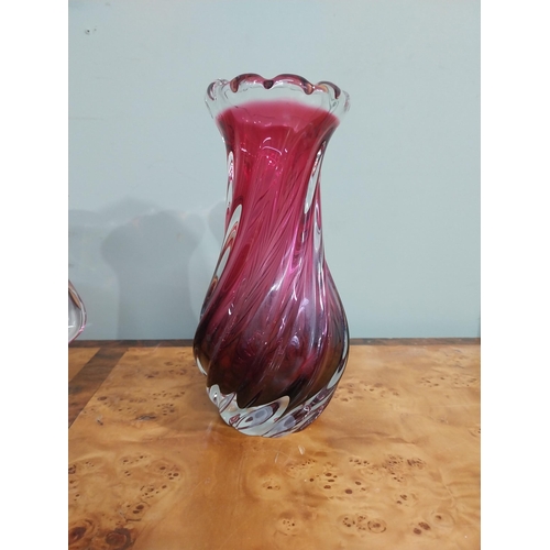 302 - Three ruby glass vases. {24 cm H}