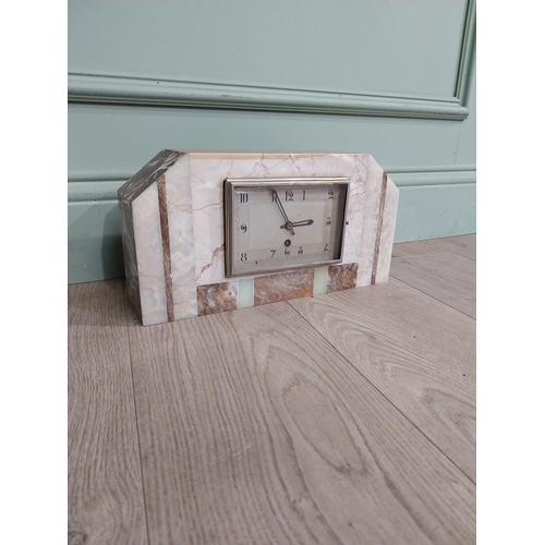 304 - Art Deco marble and onyx mantle clock with silvered dial. {18 cm H x 34 cm W x 10 cm D}.