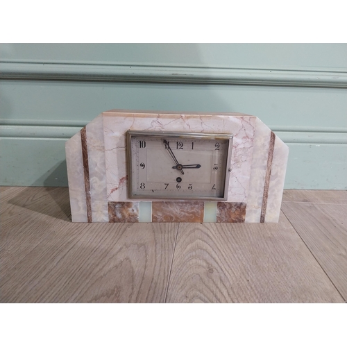 304 - Art Deco marble and onyx mantle clock with silvered dial. {18 cm H x 34 cm W x 10 cm D}.